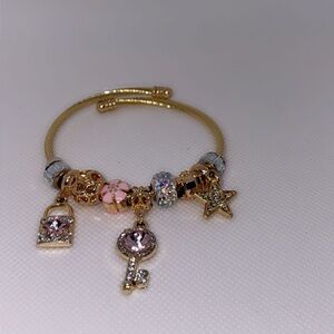 Elegant Gold Bracelet with Pink and Silver Charms